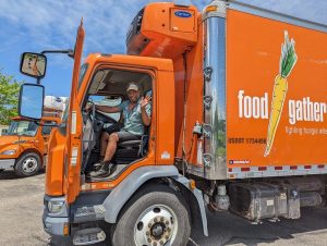 Food Gatherers Truck with a person waving back
